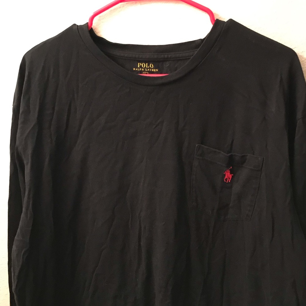 Polo Long sleeved black shirt with front pocket.